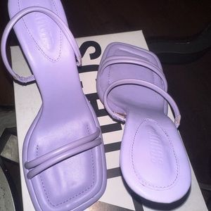 mule crafted from leather and set on a kitten heel for luxe versatility.